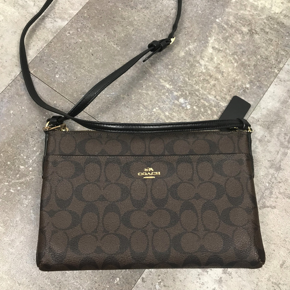 Coach Handbags - Coach East West Crossbody Black Brown